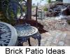 small iron patio table on brick patio