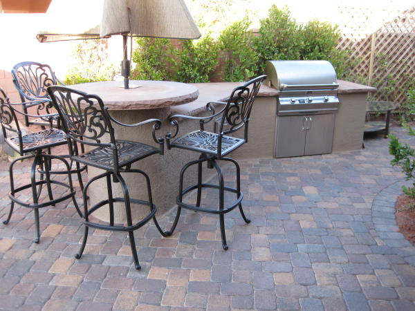 outdoor kitchen and round table top with umbrella