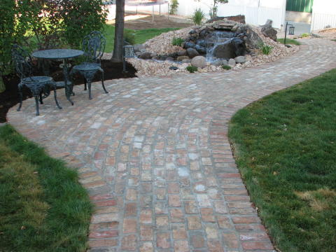 real brick walkway and side patio