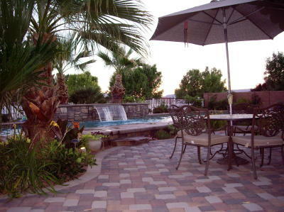 backyard patio with pavers and pool