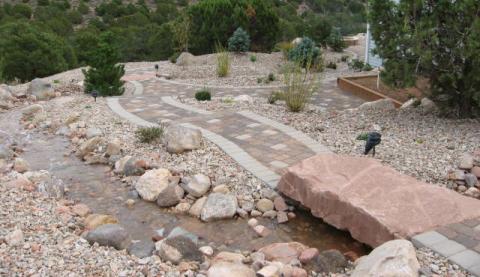 Stone bridges patio to garden grow box
